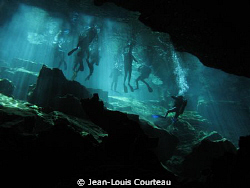 "Blue Fins"   A group of tourist divers prepares to explo... by Jean-Louis Courteau 